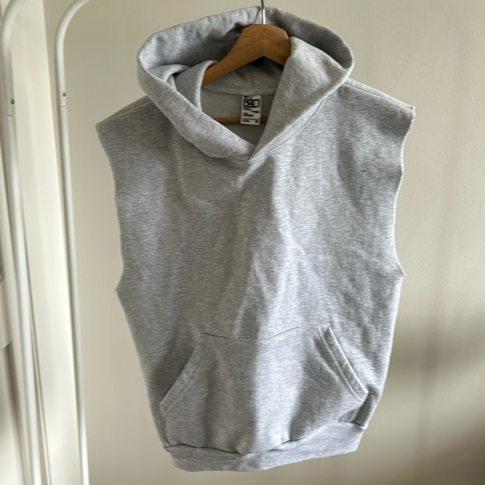 Heavy weight sleeveless hoodie. Unisex sizing. Never worn. Brand is LA Apparel.
